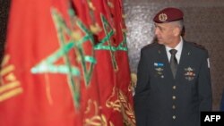 FILE: This picture by the Israeli army shows Chief of Staff Aviv Kohavi next to a Moroccan flag during his visit to King Hassan II and Mohammed V Mausoleum in Rabat on July 19, 2022.