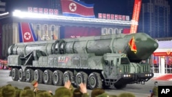 This photo provided by the North Korean government shows what it says an intercontinental ballistic missile during a military parade in Pyongyang, North Korea, Feb. 8, 2023.