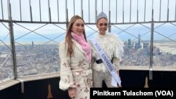 Anne Jakrajutatip (left), a Thai transgender businessperson who owns Miss Universe Organzation, stands with Miss Universe 2022 R'bonney Gabriel on 86th Floor Observatory of the Empire State Building, New York City