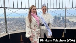 Anne Jakrajutatip (left), a Thai transgender businessperson who owns Miss Universe Organzation, stands with Miss Universe 2022 R'bonney Gabriel on 86th Floor Observatory of the Empire State Building, New York City