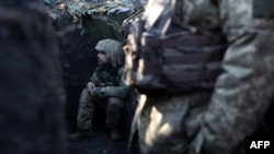 Ukrainian servicemen are seen in a trench not far from Bakhmut, Donetsk region, on Jan. 27, 2023, amid the Russian invasion of Ukraine.