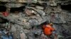 A Turkish rescue worker checks a collapsed building in Adiyaman, southern Turkey, Feb. 11, 2023. 