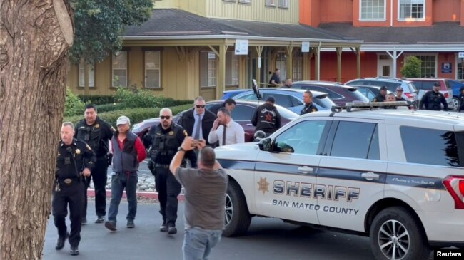 Police officers detain a man, believed by law enforcement to be the Half Moon Bay mass shooting suspect, in Half Moon Bay, California, U.S., January 23, 2023, in this screengrab taken from a social media video. (Kati McHugh via REUTERS)