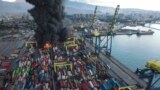 Smoke rises from burning containers at the port in the earthquake-stricken town of Iskenderun, southern Turkey, Feb. 7, 2023. 