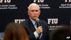 Former Vice-President Mike Pence said he takes "full responsibility" after classified documents were found at his Indiana home while speaking at Florida International University, Jan. 27, 2023, in Miami.