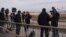 FILE - Journalists gather after a commercial airplane made an emergency landing in Barcelona's El Prat airport, Spain, Dec. 7, 2022. Finnish, Norwegian, Danish and Icelandic unions will quit a global media federation, Jan. 31, 2023, in protest at "corruptive activity."