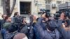 Journalists gather in front of the Iranian Embassy in Baku, Azerbaijan, Jan. 27, 2023.