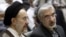 FILE - Mohammad Khatami (L) and Mir Hossein Mousavi attend a memorial service at a mosque in Tehran, Iran, July 31, 2009.
