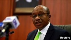FILE - Nigeria's Central Bank Governor Godwin Emefiele briefis the media during the MPC meeting in Abuja, Jan. 24, 2020.