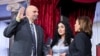 FILE - Senator John Fetterman is ceremonially sworn into office by Vice President Kamala Harris as Fetterman's wife Gisele holds the Bible during a reenactment in the Old Senate Chamber, at the US Capitol in Washington, Jan. 3, 2023. 