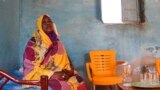 FILE - Raqiya Abdsalam, who survived a bout of dengue fever, sits at her home in El-Obeid, Sudan, on Jan. 23, 2023. 