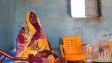 FILE - Raqiya Abdsalam, who survived a bout of dengue fever, sits at her home in El-Obeid, Sudan, on Jan. 23, 2023. 