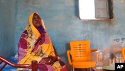 FILE - Raqiya Abdsalam, who survived a bout of dengue fever, sits at her home in El-Obeid, Sudan, on Jan. 23, 2023. 