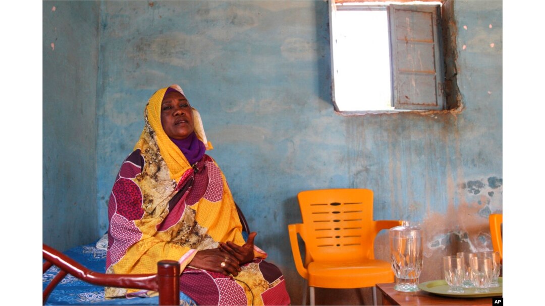FILE - Raqiya Abdsalam, who survived a bout of dengue fever, sits at her home in El-Obeid, Sudan, on Jan. 23, 2023.