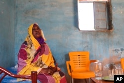 FILE - Raqiya Abdsalam, who survived a bout of dengue fever, sits at her home in El-Obeid, Sudan, on Jan. 23, 2023.