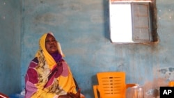 FILE - Raqiya Abdsalam, who survived a bout of dengue fever, sits at her home in El-Obeid, Sudan, on Jan. 23, 2023.