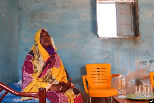 FILE - Raqiya Abdsalam, who survived a bout of dengue fever, sits at her home in El-Obeid, Sudan, on Jan. 23, 2023.