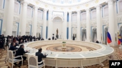 Russian President Vladimir Putin chairs a meeting with secretaries of foreign security councils on Afghan issues at the Kremlin in Moscow, Feb. 8, 2023.