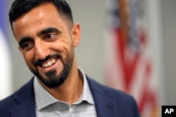 Abdul Wasi Safi smiles after a news conference in Houston, Texas, Jan. 27, 2023.