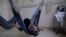 Yanomami indigenous children being treated for malnutrition lie on hammocks with their father at the special ward for indigenous people of the Santo Antonio Children's Hospital in Boa Vista, Brazil, Jan. 27, 2023.