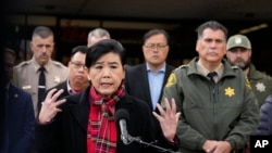 Rep. Judy Chu, left, addresses the media with Los Angeles County Sheriff Robert Luna, right, outside the Civic Center in Monterey Park, Calif., Jan. 22, 2023. 