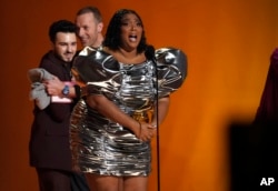 Lizzo accepts the award for record of the year for "About Damn Time" at the 65th annual Grammy Awards on Sunday, Feb. 5, 2023, in Los Angeles. (AP Photo/Chris Pizzello)