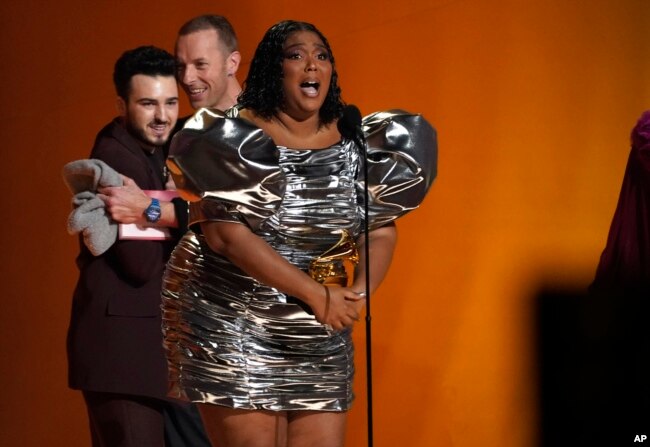 Lizzo accepts the award for record of the year for "About Damn Time" at the 65th annual Grammy Awards on Sunday, Feb. 5, 2023, in Los Angeles. (AP Photo/Chris Pizzello)