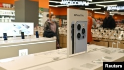 FILE - A showcase of Apple products at an electronics store sits empty in Omsk, Russia, March 2, 2022. Apple stopped delivering its products to Russia after it invaded Ukraine, but orders in other countries surged and were shipped to there. 