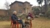 Two siblings Dr. Dildar Ahmad and Mir Noosheen Nighat, discussing work of their poet father, Rehman Rahi, who died at 97 in the Nowshera area of Srinagar in Indian-administered Kashmir. (Bilal Hussain/VOA)