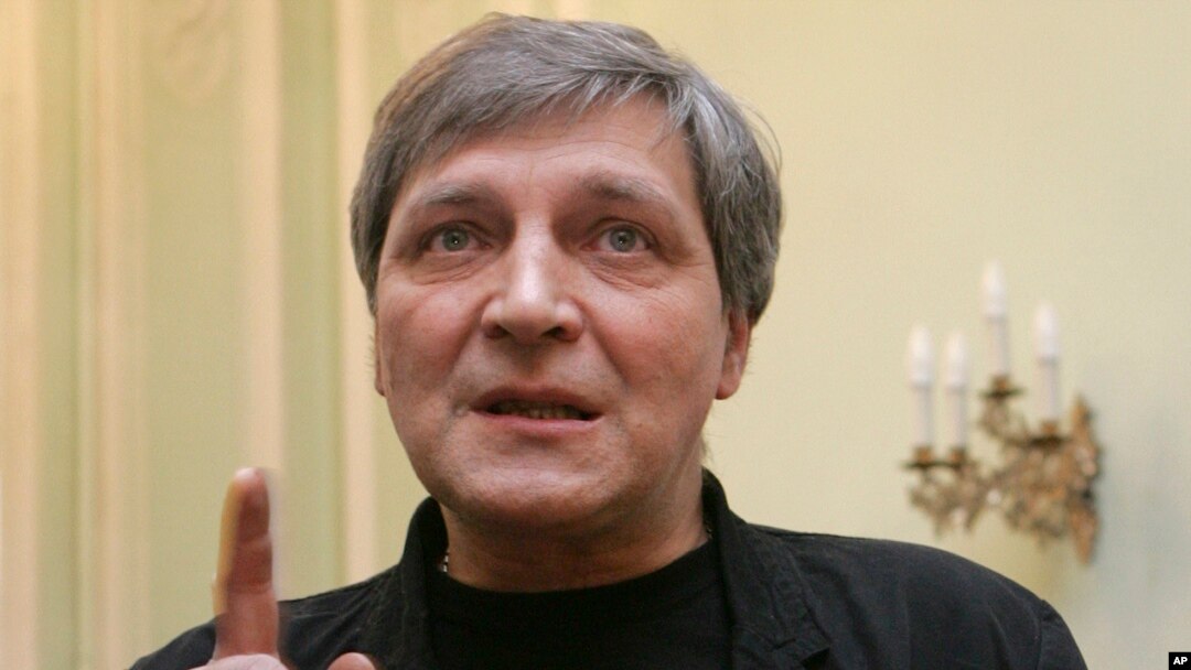 FILE - Television journalist Alexander Nevzorov speaks in St. Petersburg, Feb. 24, 2012. A court in Moscow on Wednesday sentenced Nevzorov in absentia to eight years in prison.