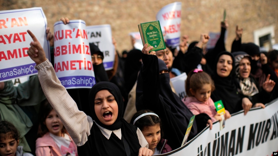 Women shout slogans during a protest outside the Swedish consulate in Istanbul, Turkey, Jan. 22, 2023, condemning a Quran-burning rally in Sweden.