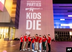 Members of Students Demand Action, a grassroots network of Everytown for Gun Safety, call out the firearms industry during a trade show, Jan. 16, 2023, in Las Vegas. The students demanded that the firearms industry adopt responsible business practices that would reduce gun violence.