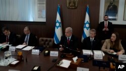 Israel's Prime Minister Benjamin Netanyahu, center, chairs the weekly cabinet meeting in Jerusalem, Jan. 22, 2023.