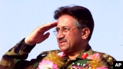 FILE - President of Pakistan Gen. Pervez Musharraf salutes on April 9, 2002, at a rally in Lahore, Pakistan.
