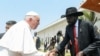 Pope Francis shakes hands with South Sudan's President Salva Kiir, during his farewell ceremony in Juba, February 5, 2023