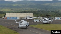 FILE - Helicopters serving in the United Nations Organization Stabilization Mission in the Democratic Republic of the Congo (MONUSCO), are seen at an airport the town of Bukavu, DRC, Oct. 23, 2018.