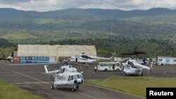 FILE - Helicopters serving in the United Nations Organization Stabilization Mission in the Democratic Republic of the Congo (MONUSCO), are seen at an airport the town of Bukavu, DRC, Oct. 23, 2018.