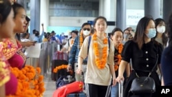 Chinese tourists arrive at Ngurah Rai International Airport in Bali, Indonesia, Jan. 22, 2023.