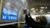 FILE - Workers ready a shipment of relief aid to Gaza at the warehouses of the Jordan Hashemite Charity Organization, sent by UN Relief and Works Agency (UNRWA)