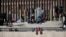 FILE - Migrants wait on the the border between Mexico and the United states, as seen from Ciudad Juarez, Mexico, Jan. 8, 2023.
