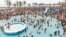 FILE - Revelers gather at North Pier Beach swimming pools in Durban, South Africa, Jan. 1, 2020. Just one South African in seven knows how to swim, the National Sea Rescue Institute says. Container pools are now being used to teach children to float.