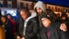 FILE - Tammy Chance, left, mother of Jalil George, 24, who was fatally shot Dec. 7, 2022, in Baltimore, stands with George's stepfather and grandmother during a vigil for George, Dec. 14, 2022, in Baltimore.