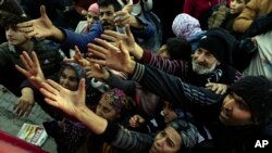 Volunteers give out aid to people in Antakya, southern Turkey.&nbsp;Thinly stretched rescue teams worked through the night into Wednesday, pulling more bodies from the rubble of thousands of buildings downed in Turkey and Syria by a massive earthquake.&nbsp;