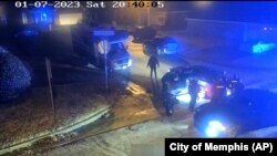 In this image from video released and partially redacted by the city of Memphis, Tenn., Jan. 27, 2023, Tyre Nichols leans against a car after a brutal attack by five Memphis Police officers on Jan. 7, in Memphis. 