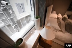 Snow is pictured from inside a room of one of two houses built to develop future heating solutions at Energy House 2.0 in Salford, UK, Jan. 24, 2023.