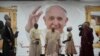 Pope Francis meets a displaced girl during a meeting with internally displaced persons in the "Freedom Hall" in Juba, South Sudan, Saturday, Feb. 4, 2023.