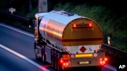 FILE - A fuel trucks drives along a highway in Frankfurt, Germany, Jan. 27, 2023. European Union governments have agreed to place an embargo on Russian diesel which comes into effect Sunday.