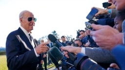President Joe Biden talks with reporters on the South Lawn of the White House in Washington, Jan. 30, 2023.