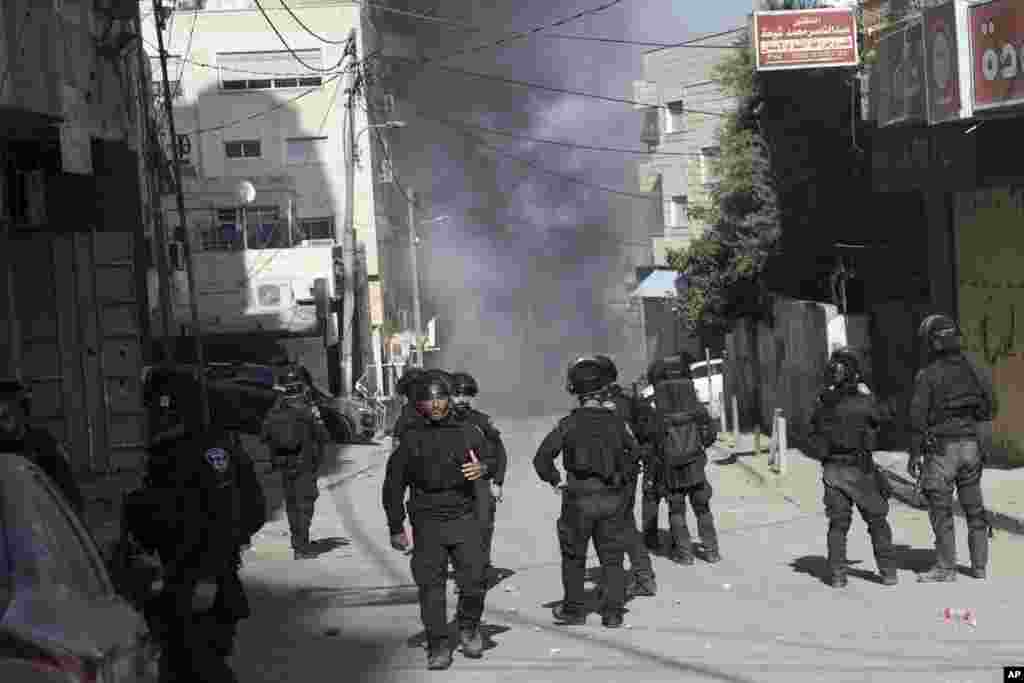 Israeli security forces are deployed as the home of Palestinian gunman Uday Tamimi is destroyed in the West Bank village of Anata, near Jerusalem.