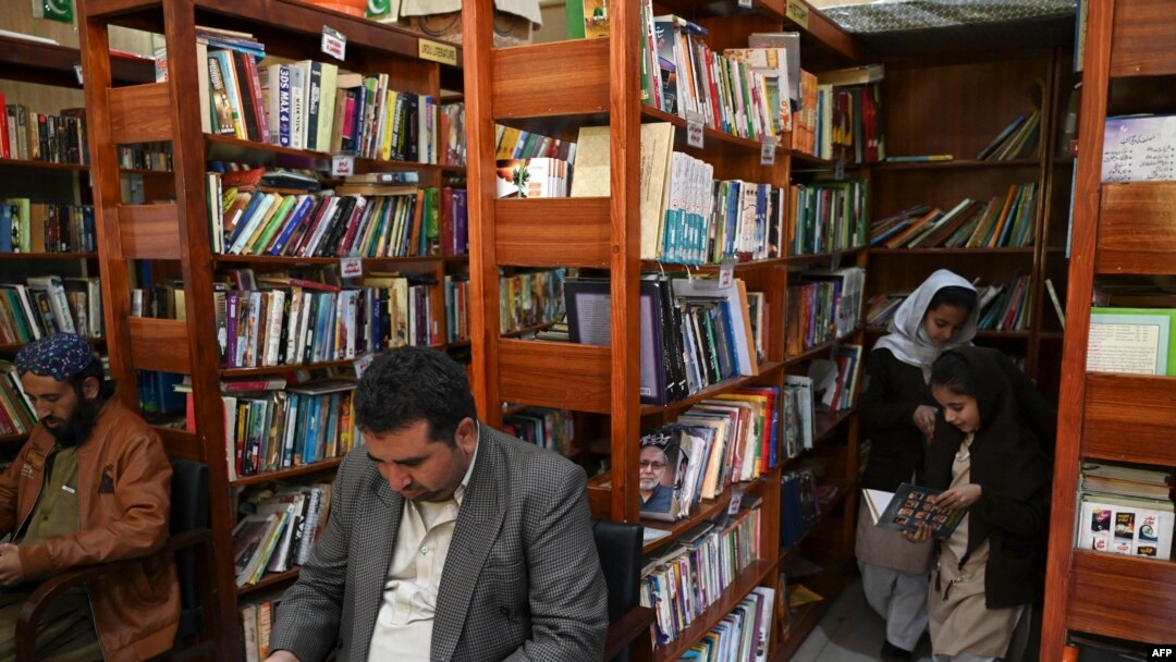 People read books inside the Darra Adam Khel Library in Darra Adamkhel town, 35 kilometers south of Peshawar, Pakistan, Dec. 14, 2022.
